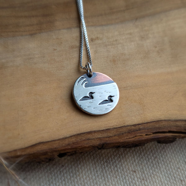 Loons on the lake - mixed metal loon wildlife pendant necklace