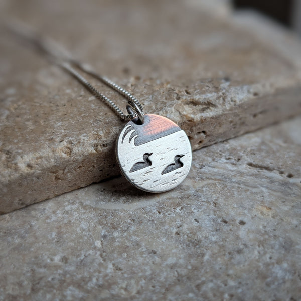 Loons on the lake - mixed metal loon wildlife pendant necklace