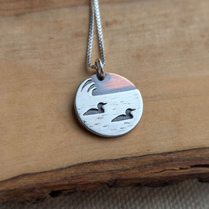 Loons on the lake - mixed metal loon wildlife pendant necklace