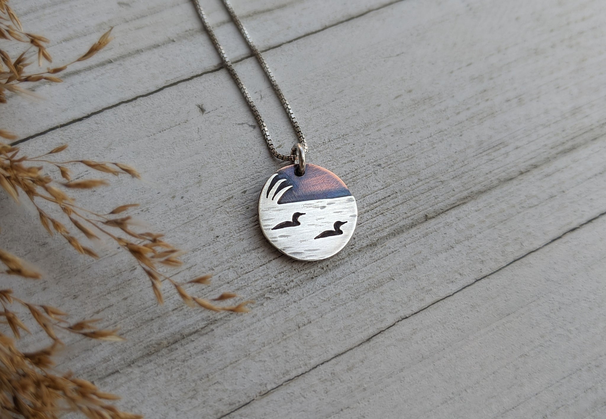 Loons on the lake - mixed metal loon wildlife pendant necklace