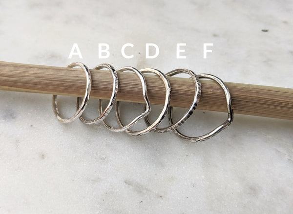 Six rings labeled A-F with different hammered texture and finish